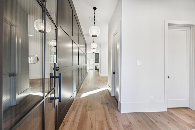 hall with light wood-type flooring