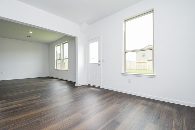 entryway with dark wood-type flooring