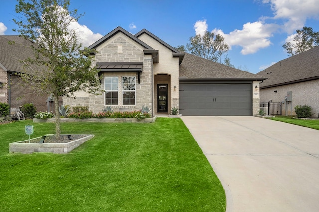 view of front of home featuring a garage and a front lawn