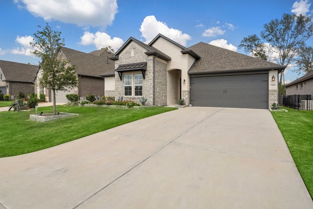 view of front of home with a front lawn and a garage