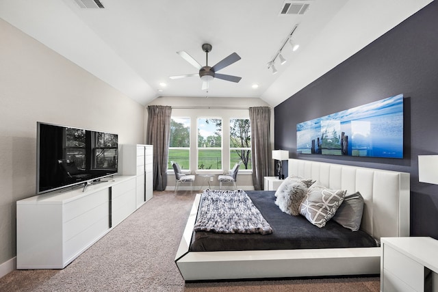 bedroom featuring ceiling fan, carpet floors, lofted ceiling, and rail lighting