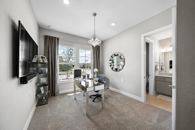 carpeted office with an inviting chandelier