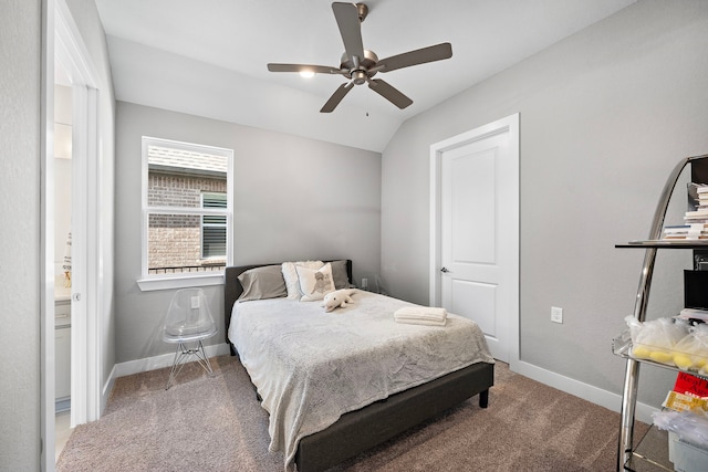 carpeted bedroom featuring vaulted ceiling and ceiling fan