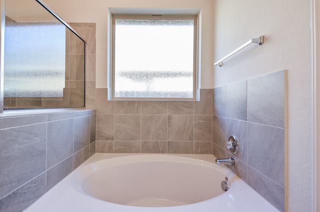 bathroom featuring a bath