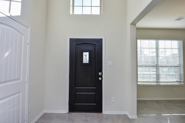 foyer with light tile patterned flooring