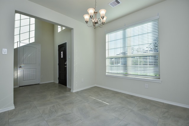 entrance foyer with a notable chandelier