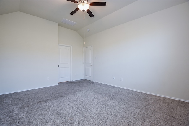 carpeted empty room featuring vaulted ceiling and ceiling fan