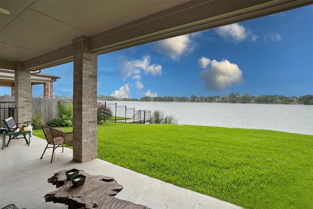 view of yard featuring a patio area and a water view