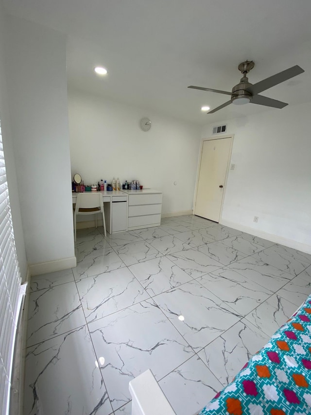 spare room featuring ceiling fan