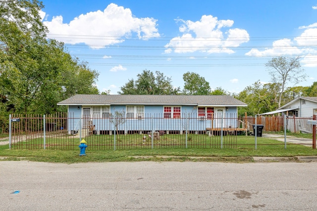 ranch-style house with a front lawn