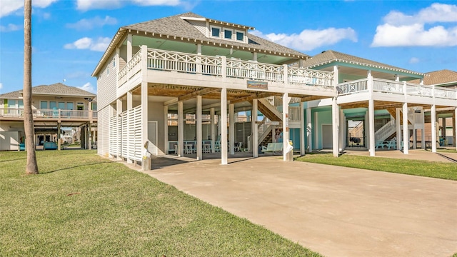 rear view of property featuring a yard