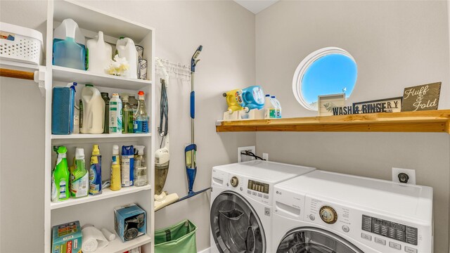 laundry room featuring washer and clothes dryer