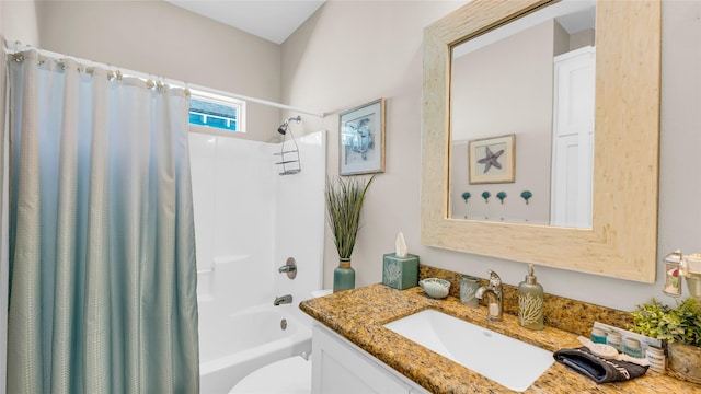 full bathroom featuring vanity, toilet, and shower / bath combo with shower curtain