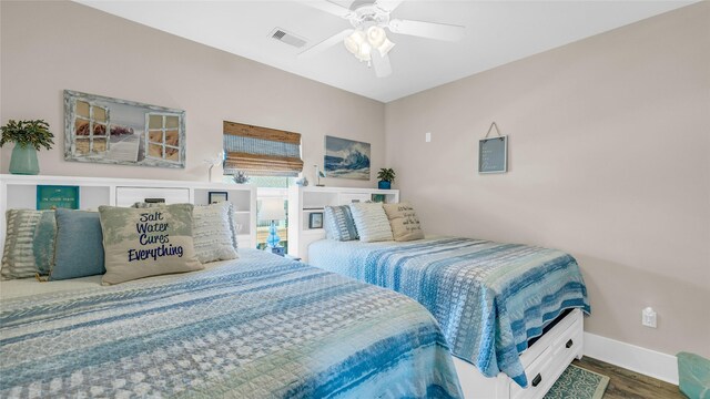 bedroom featuring ceiling fan and dark hardwood / wood-style flooring