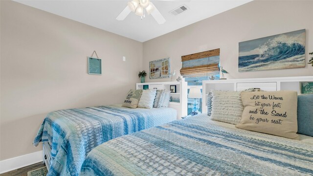 bedroom with hardwood / wood-style flooring and ceiling fan