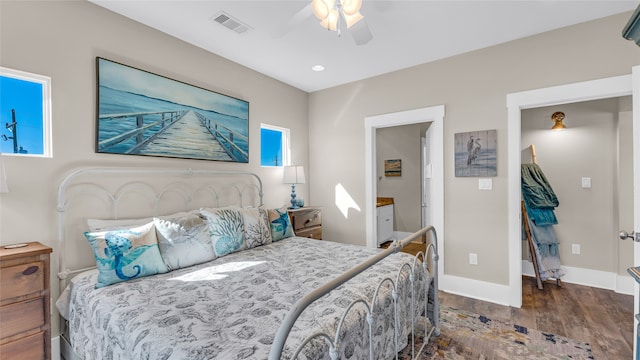 bedroom with ceiling fan and dark wood-type flooring