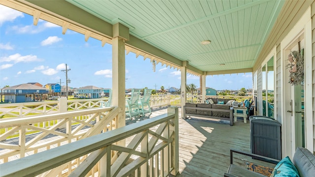 wooden deck featuring an outdoor living space