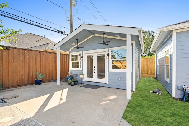 rear view of house with a lawn, a patio area, ceiling fan, and french doors