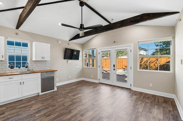 kitchen featuring white cabinets, french doors, stainless steel dishwasher, and wood counters