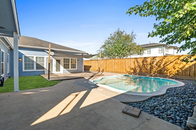 view of swimming pool featuring french doors and a patio