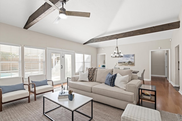 living room featuring vaulted ceiling with beams, hardwood / wood-style floors, and ceiling fan with notable chandelier