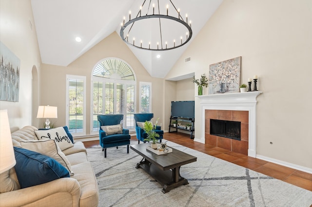 tiled living room with a fireplace and high vaulted ceiling