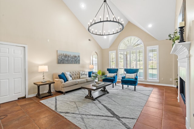 tiled living room featuring a chandelier and high vaulted ceiling