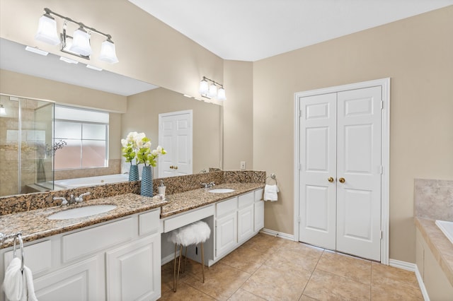 bathroom with tile patterned floors, vanity, and separate shower and tub