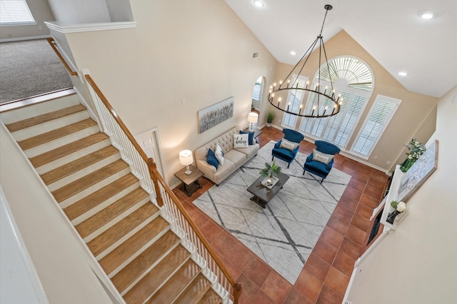 living room with tile patterned flooring, a notable chandelier, and high vaulted ceiling