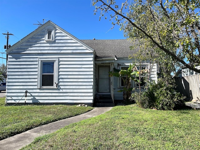 1201 Walton St, Houston, TX 77009 - bungalow-style house featuring entry steps and roof with shingles