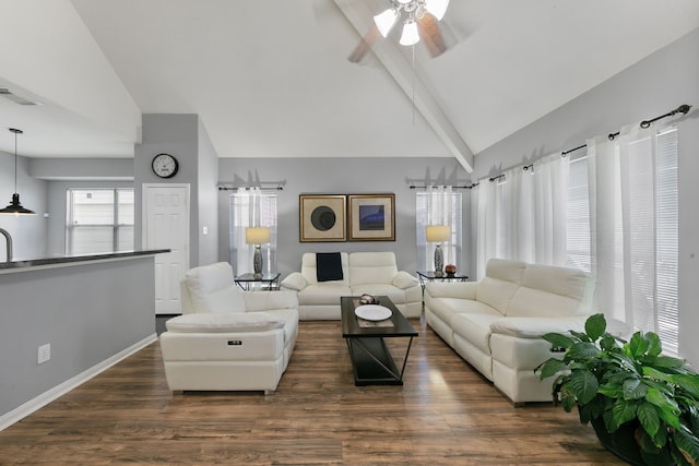 living room with ceiling fan, dark hardwood / wood-style flooring, beamed ceiling, and high vaulted ceiling