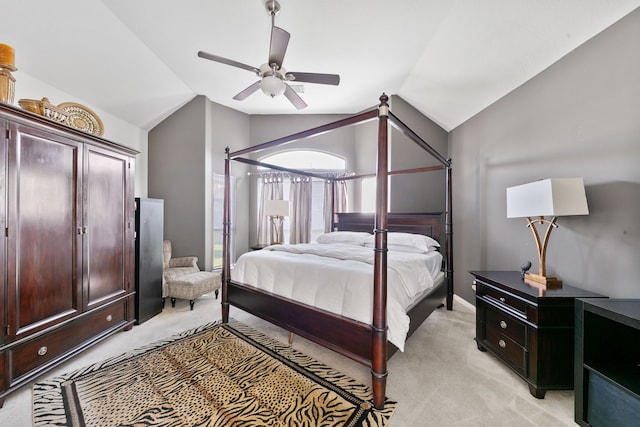 bedroom featuring ceiling fan, light carpet, and vaulted ceiling