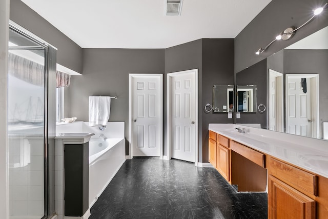 bathroom with vanity and independent shower and bath