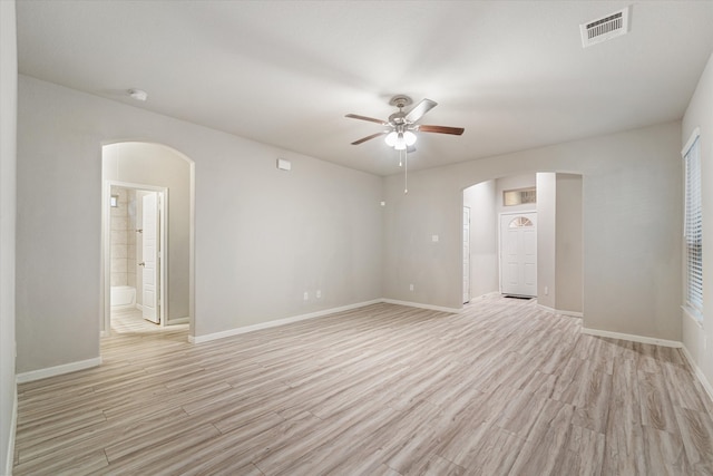 empty room featuring ceiling fan and light hardwood / wood-style floors