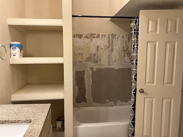 bathroom featuring vanity and shower / bath combo