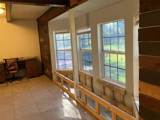 doorway with light tile patterned floors