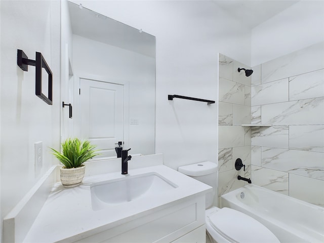 full bathroom with vanity, tiled shower / bath combo, and toilet