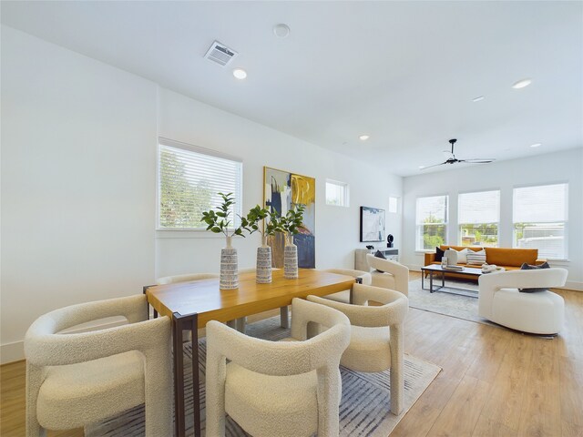 dining space featuring a wealth of natural light, ceiling fan, and light hardwood / wood-style floors