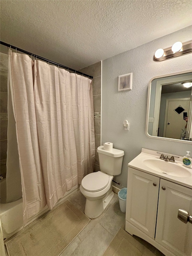 full bathroom featuring tile patterned floors, shower / bathtub combination with curtain, vanity, and a textured ceiling