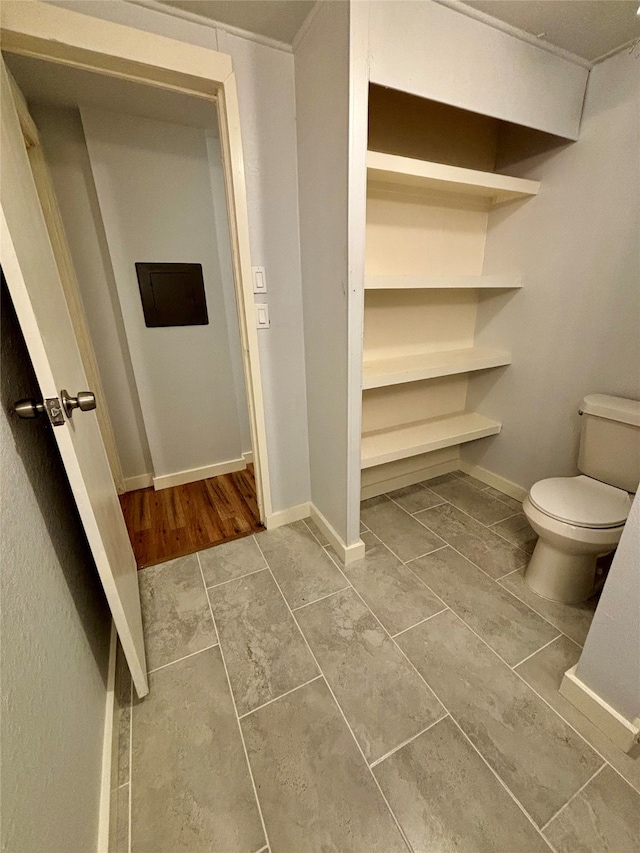 bathroom with tile patterned flooring and toilet