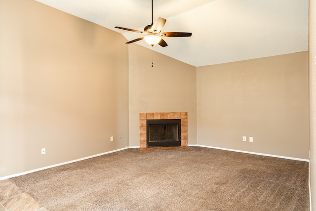 unfurnished living room with a tile fireplace, carpet, ceiling fan, and lofted ceiling