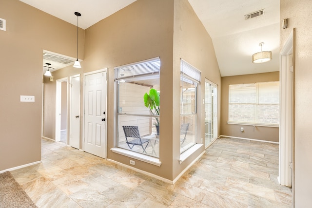 entryway featuring lofted ceiling