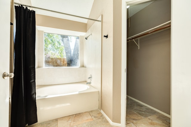 bathroom with shower / bath combo