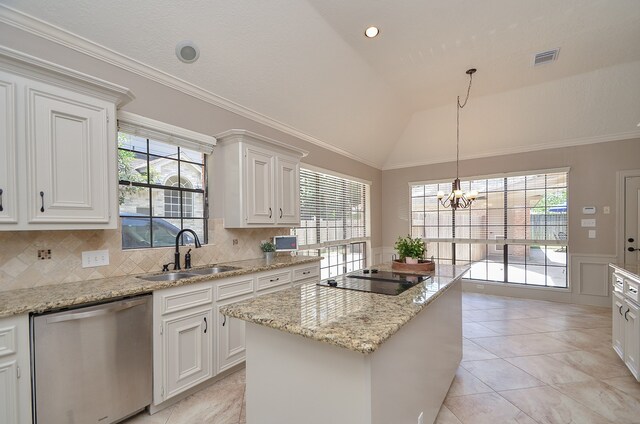 kitchen with stainless steel dishwasher, white cabinetry, lofted ceiling, and sink