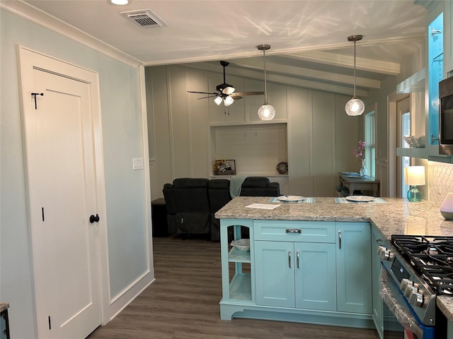 kitchen with decorative light fixtures, dark hardwood / wood-style floors, kitchen peninsula, stainless steel stove, and light stone countertops