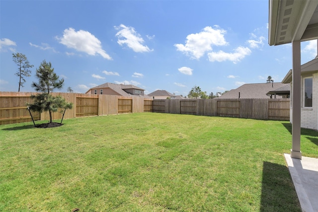 view of yard with a fenced backyard