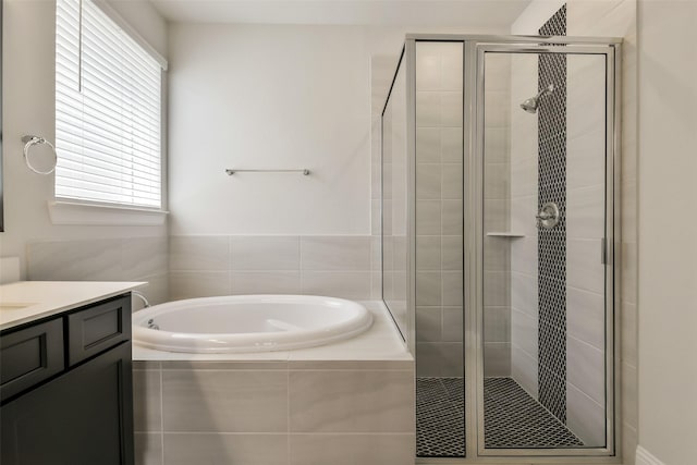 full bath with a shower stall, a garden tub, and vanity
