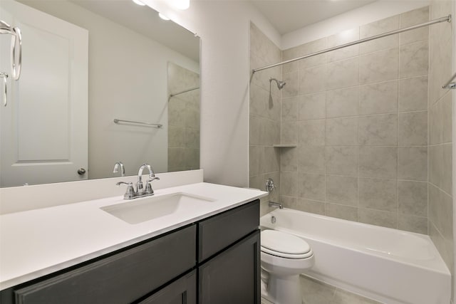 bathroom with bathtub / shower combination, tile patterned floors, vanity, and toilet