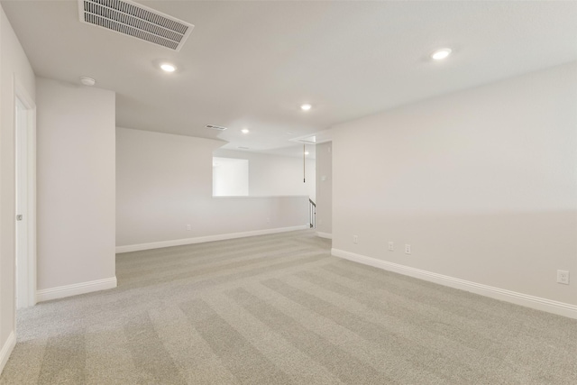 basement featuring recessed lighting, visible vents, carpet flooring, and baseboards