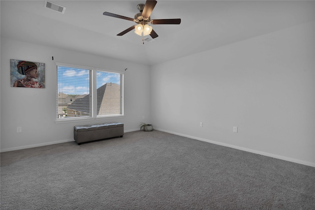 carpeted empty room featuring ceiling fan and lofted ceiling